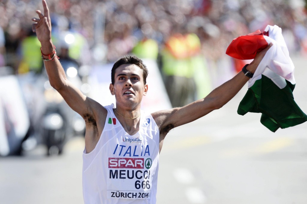epa04357537 Daniele Meucci from Italy wins the men's Marathon in the city centre of Zurich at the European Athletics Championships in the Letzigrund Stadium in Zurich, Switzerland, 17 August 2014. EPA/WALTER BIERI